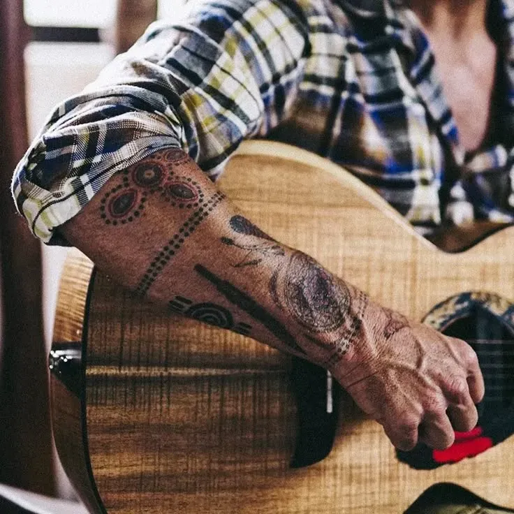 Meaning Behind the Ink: Xavier Rudd Tattoo Designs