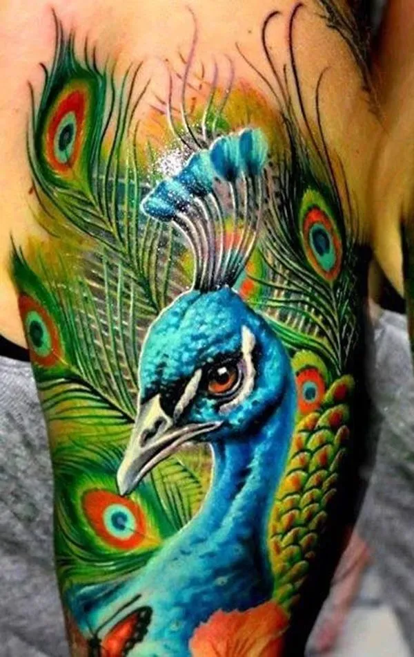 The Deep Meaning Behind Peacock Tattoo Designs